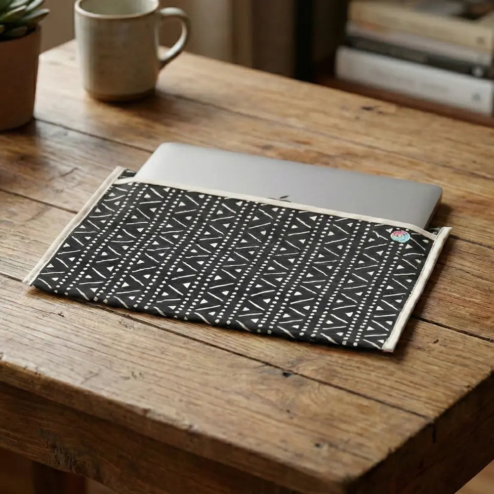 Upcycled Fabric Folder - Laptop Cover - Geometric print in black and white, featuring a secure leather strap closure