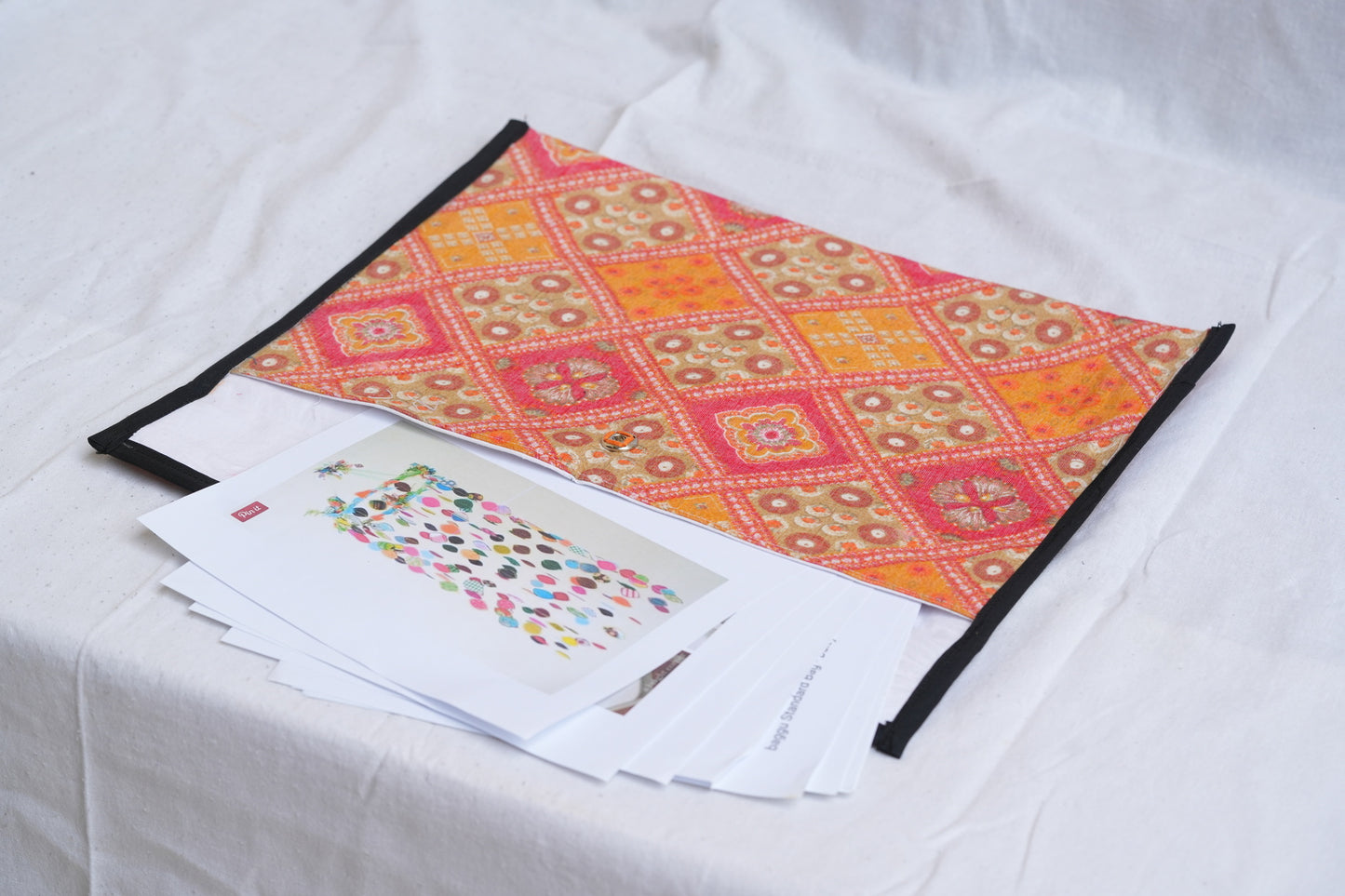 Upcycled Fabric Folder - Laptop Cover - Orange Batik with Cream Leaf Pattern and Black Trim