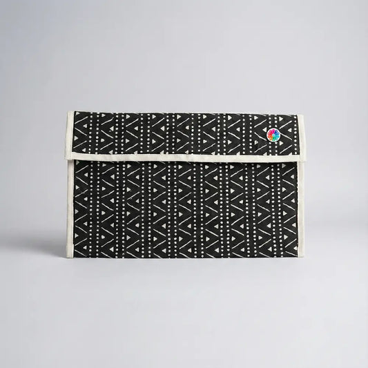 Upcycled Fabric Folder - Laptop Cover - Geometric print in black and white, featuring a secure leather strap closure