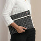 Upcycled Fabric Folder - Laptop Cover - Geometric print in black and white, featuring a secure leather strap closure