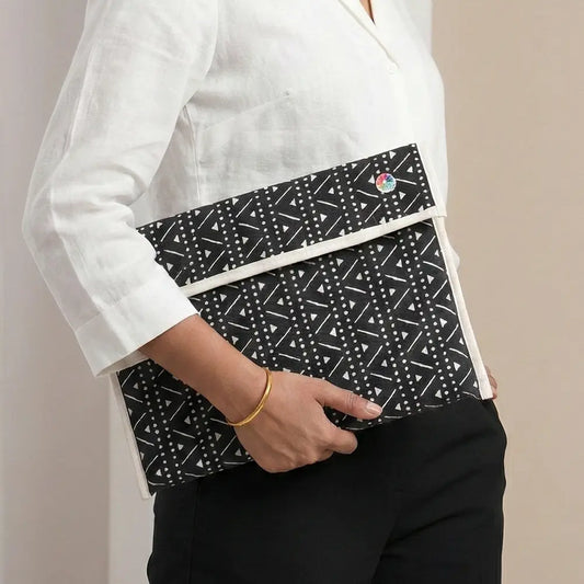 Upcycled Fabric Folder - Laptop Cover - Geometric print in black and white, featuring a secure leather strap closure